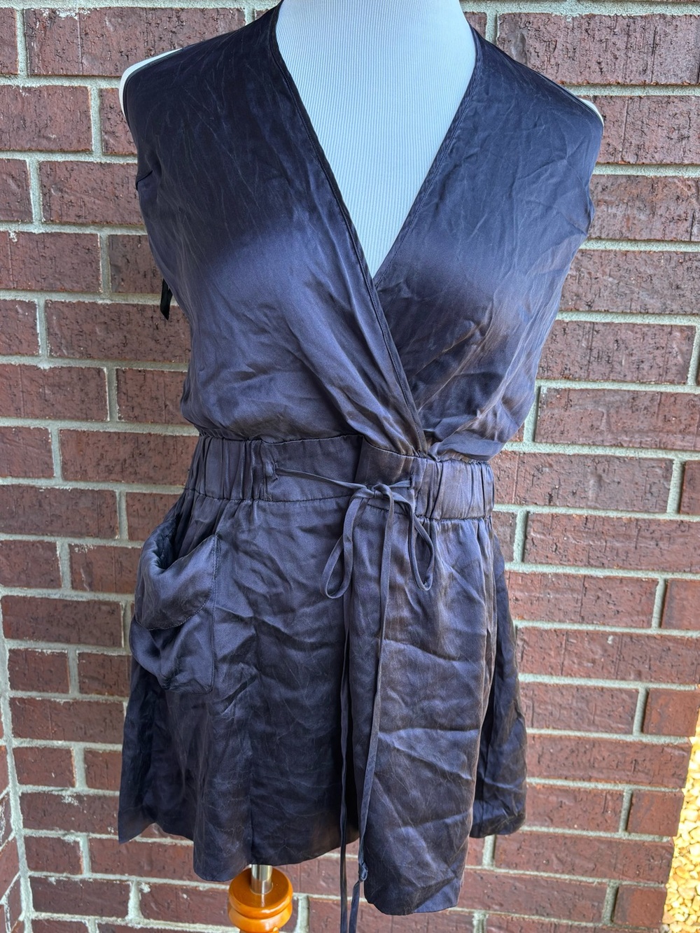 Sleeveless V-Neck Tie-Waist Satin Romper in Deep Charcoal